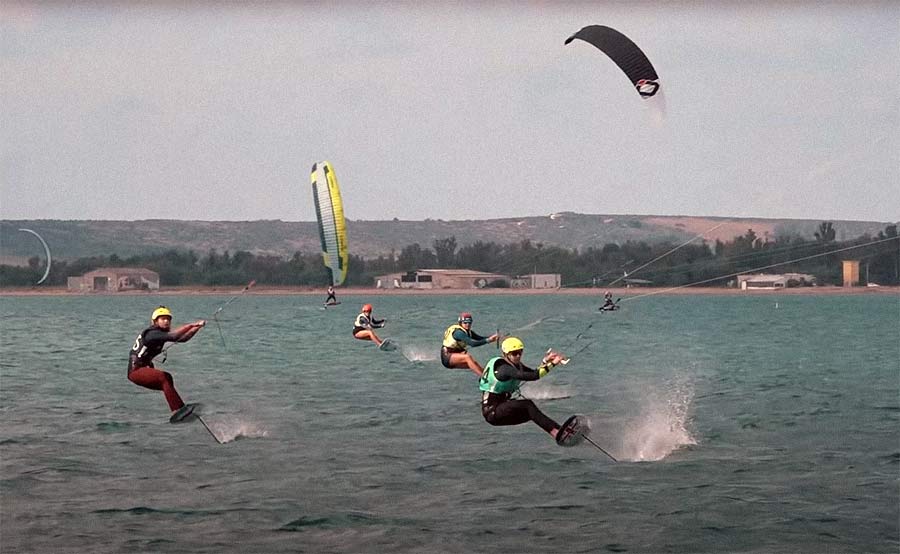 people riding kitesurfusing a foil